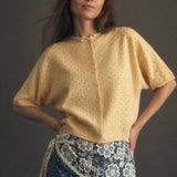Light yellow pointelle cotton cardigan button down front view women’s summer cardigan styled with denim and lace details