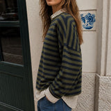 Side view of Piper Pullover Sweater in olive and navy stripe with relaxed fit