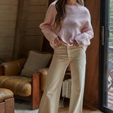 Model wearing the Piper Soft Knit Crew Sweater in Baby Pink with relaxed neutral pants - full view