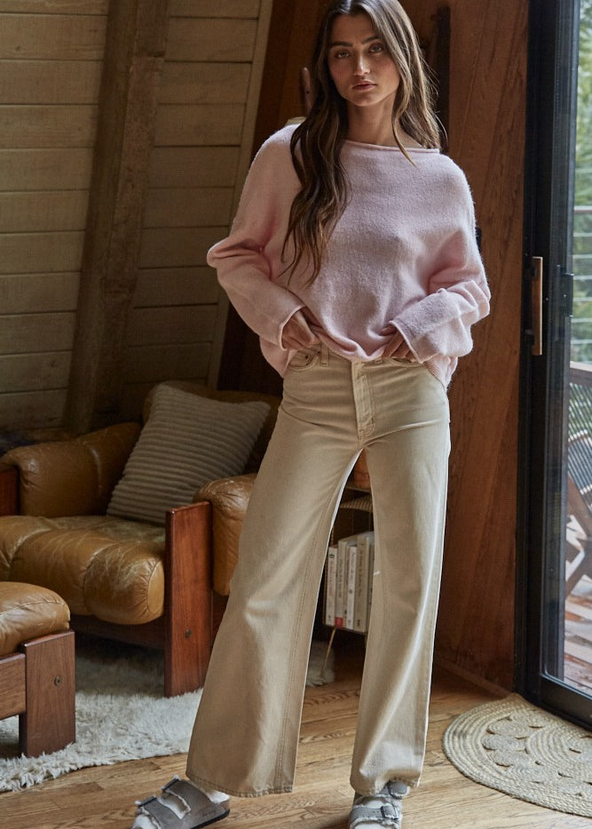 Model wearing the Piper Soft Knit Crew Sweater in Baby Pink with relaxed neutral pants - full view