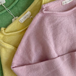 Close-up of the soft knit texture and Baby Pink color of the Piper Crew Sweater