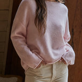 Model wearing the Piper Soft Knit Crew Sweater in Baby Pink with relaxed neutral pants - full view - side front fiew