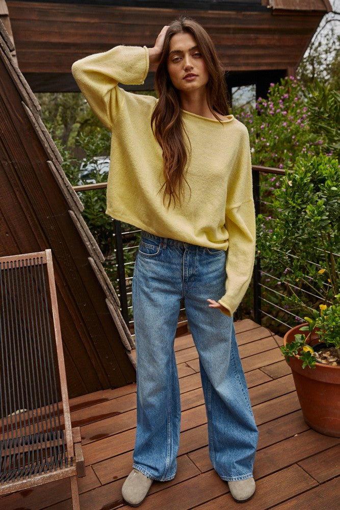 Model wearing the Piper Soft Knit Crew Sweater in Banana with relaxed neutral pants - full outfit