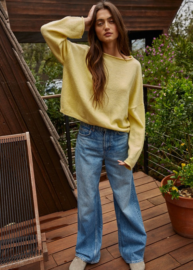Model wearing the Piper Soft Knit Crew Sweater in Banana with relaxed neutral pants - full outfit