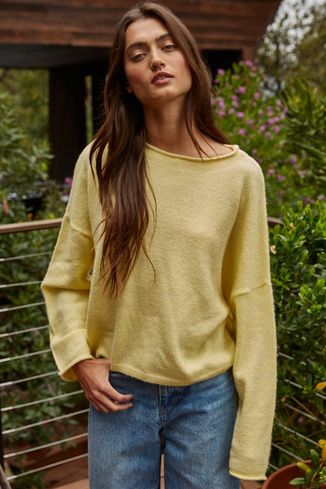 Model wearing the Piper Soft Knit Crew Sweater in Banana with relaxed neutral pants