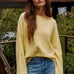 Model wearing the Piper Soft Knit Crew Sweater in Banana with relaxed neutral pants - front view