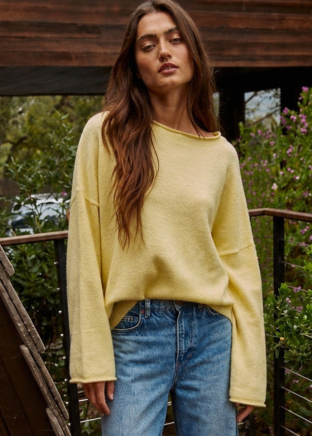 Model wearing the Piper Soft Knit Crew Sweater in Banana with relaxed neutral pants - front view