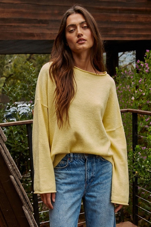 Model wearing the Piper Soft Knit Crew Sweater in Banana with relaxed neutral pants - front view