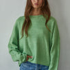 Model wearing the Piper Soft Knit Crew Sweater in Green with relaxed neutral pants - front view- main image