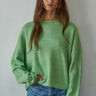 Model wearing the Piper Soft Knit Crew Sweater in Green with relaxed neutral pants - front view- main image