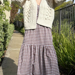Full-body view of the Popcorn Stitch Chunky Knit Cardigan in ivory styled casually outdoors