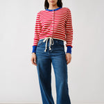 Full body view of Porta striped button down cardigan sweater styled with jeans