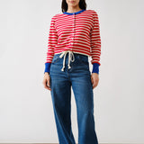 Full body view of Porta striped button down cardigan sweater styled with jeans