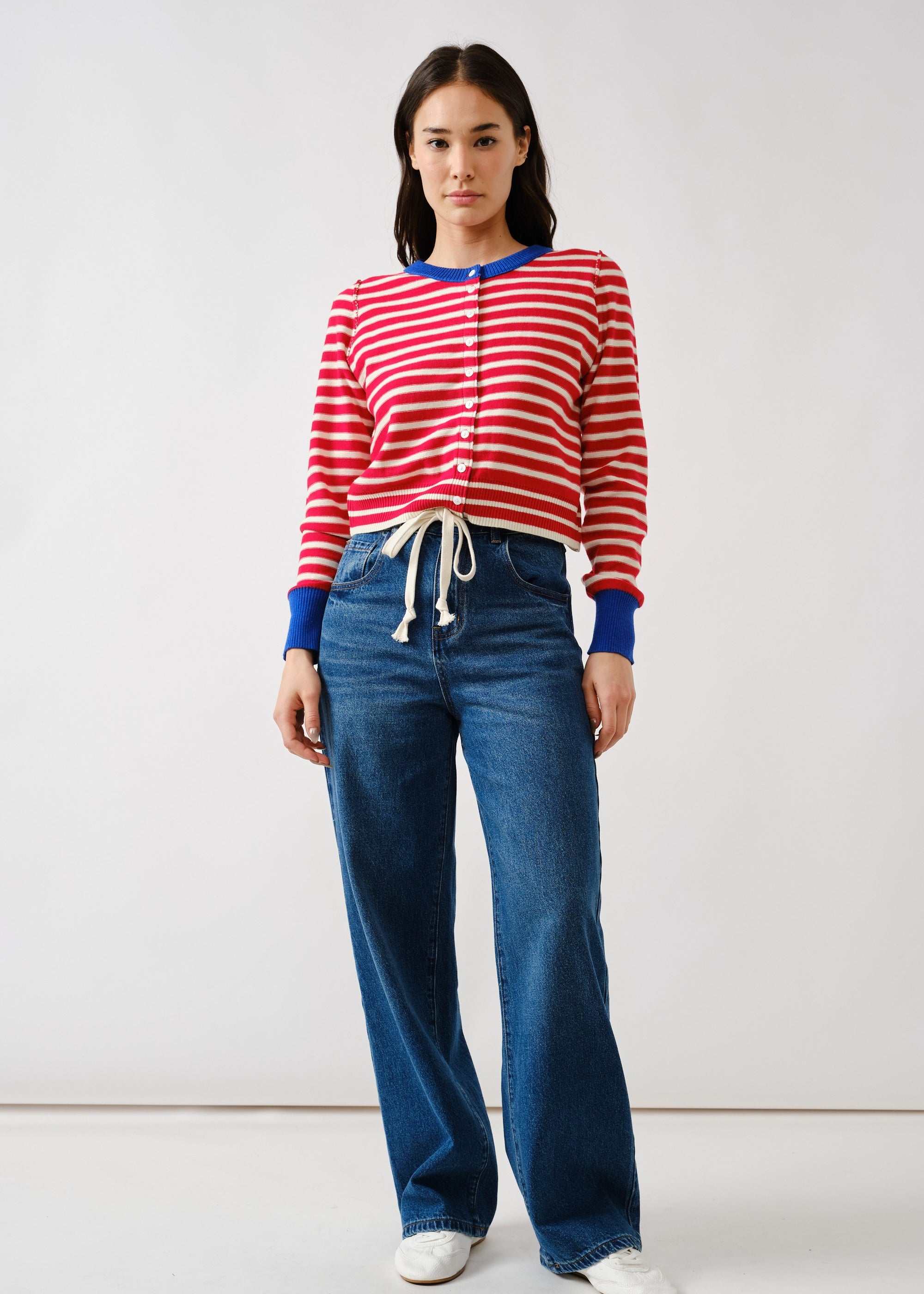 Full body view of Porta striped button down cardigan sweater styled with jeans