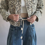 Model wearing Margo pleated pull-on denim pants with drawstring waistband