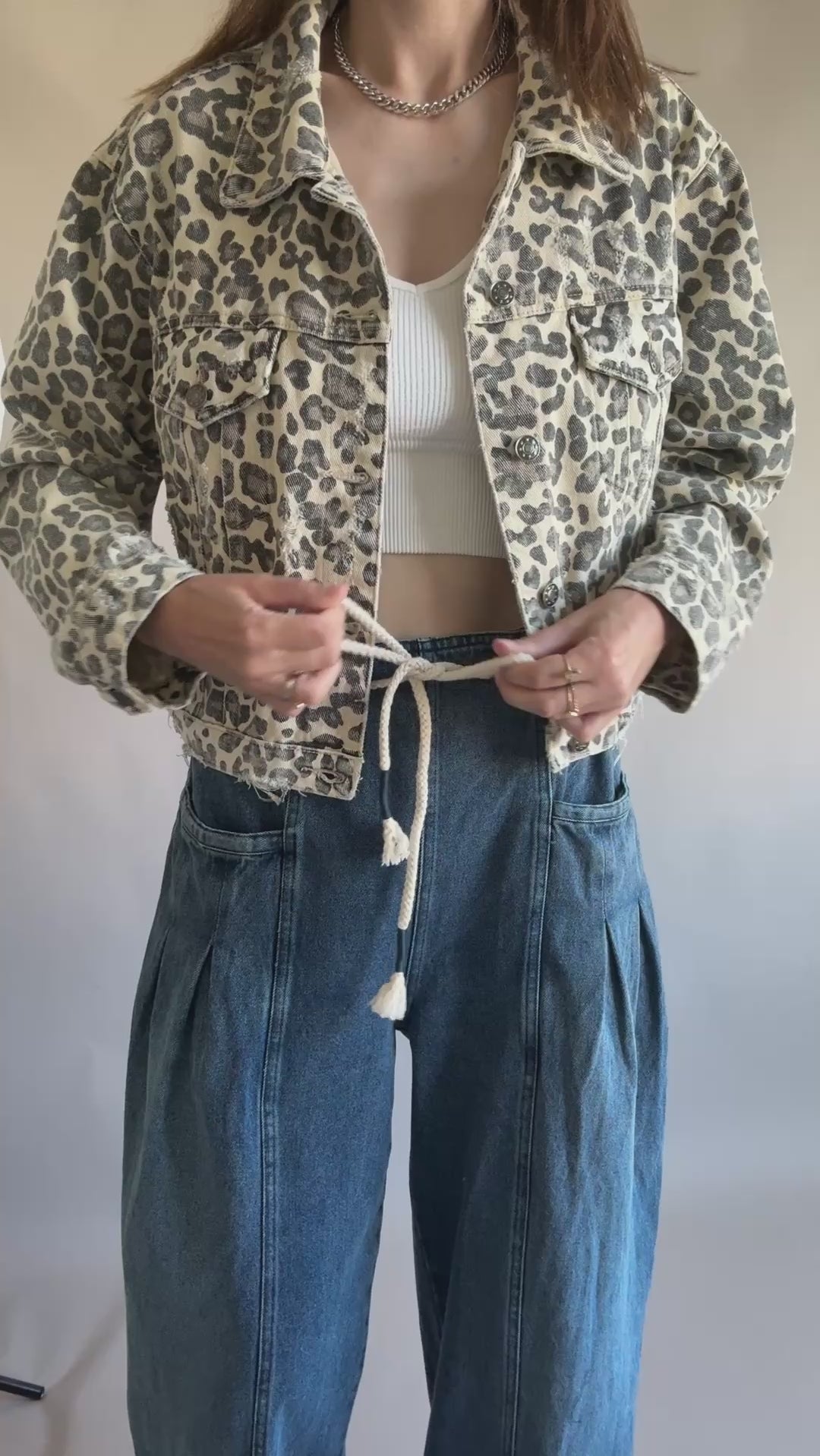Model wearing Margo pleated pull-on denim pants with drawstring waistband