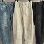 Hanging display video showing three colorways of the floral embroidered barrel-leg jeans, highlighting wash variations and embroidery details