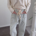 Try-on video of Moxie barrel eyelet jeans in denim stripe showing fit and movement