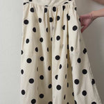 Close-up video of the Lowen Full Midi Skirt in Polka Dot Cream showing the black polka dot print, gathered waist, soft cotton-lyocell fabric, side pockets, and full midi silhouette
