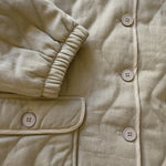 Flat-lay video of the Magnolia Wave Quilted Cotton Jacket showcasing quilting details, stitching, and cotton fabric texture