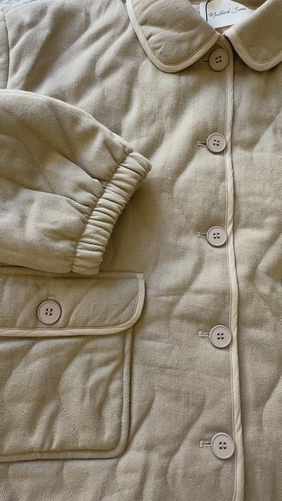 Flat-lay video of the Magnolia Wave Quilted Cotton Jacket showcasing quilting details, stitching, and cotton fabric texture