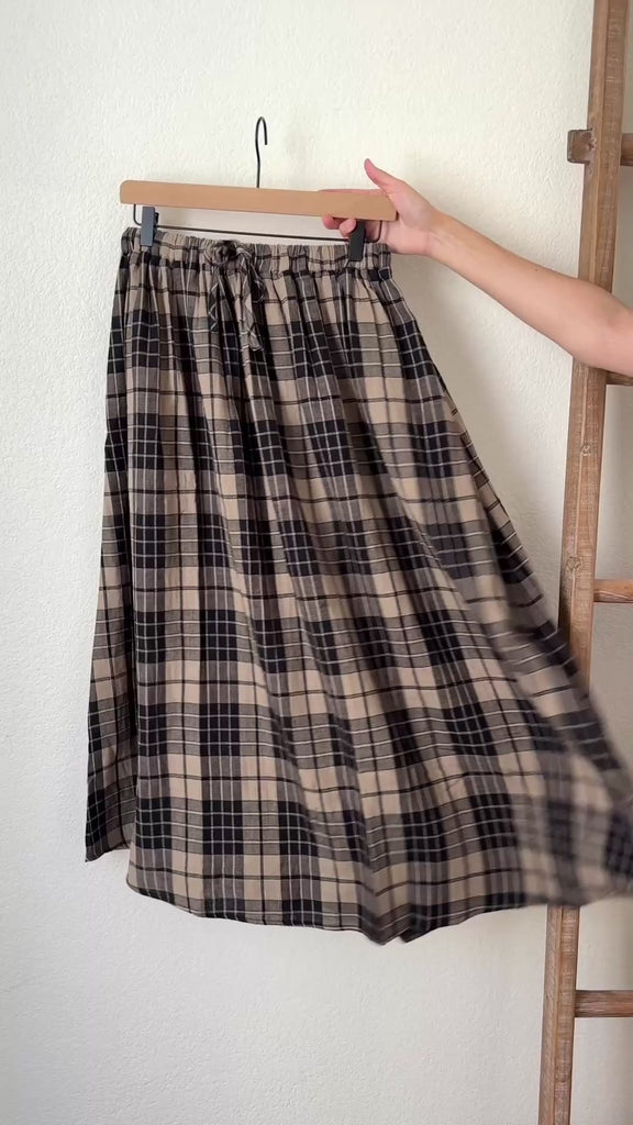 video of details of Ives plaid A-line maxi skirt in black and stone