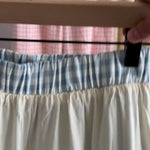 Close-up video showing elastic waistband, lining and cotton gingham fabric