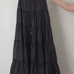 Video of the One Brynn black cotton tiered maxi skirt showing movement and fabric texture