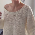 Try-on video of SoftSpun textured boatneck sweater in cream showing relaxed fit and off-shoulder styling