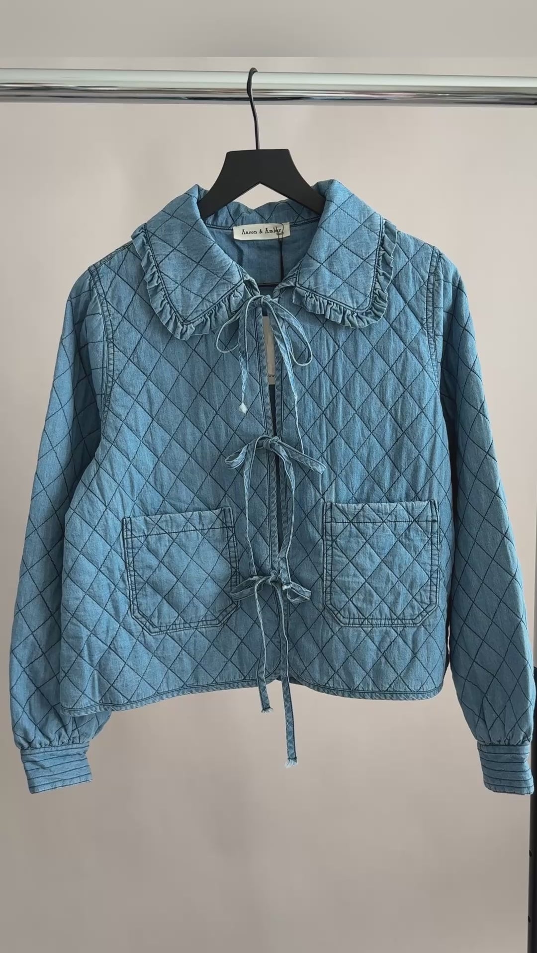 Close-up video of Chloe Bow Quilted Denim Jacket showing quilted texture and bow tie closures