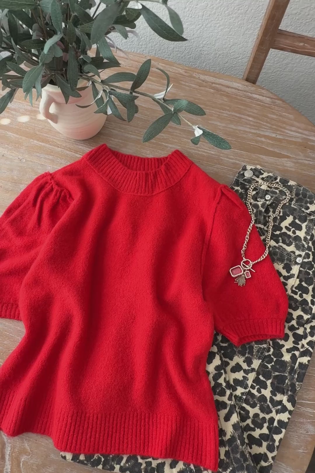 Overview video of the Soft Balloon Sleeve Short Sleeve Sweater in red, showing fit, balloon sleeves, and knit texture