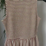 Close-up video of smocked bodice and striped fabric on Darcy maxi dress