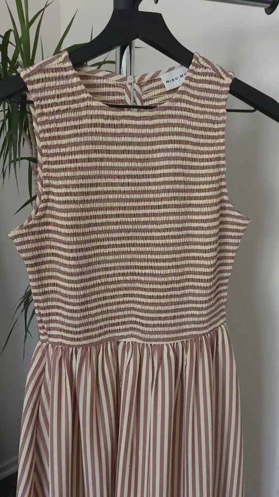 Close-up video of smocked bodice and striped fabric on Darcy maxi dress