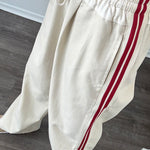 Try-on video of The Brooklin side-stripe pull-on wide-leg pants in beige showing relaxed fit and movement