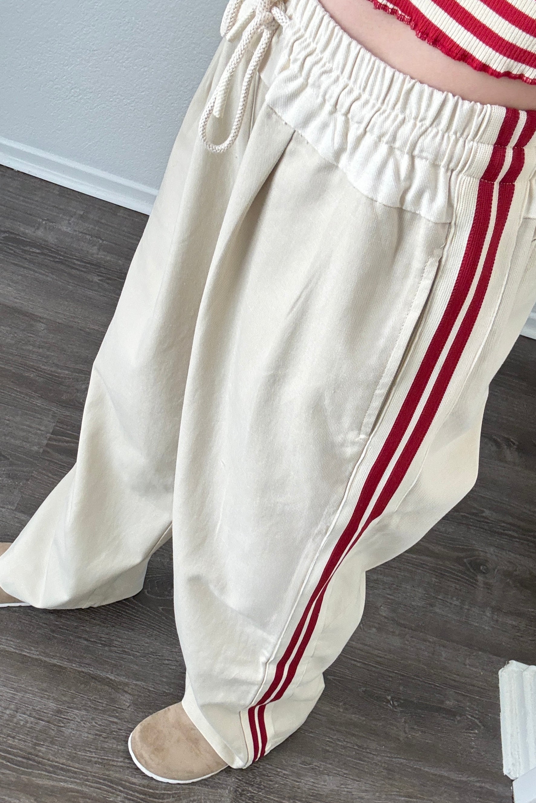 Try-on video of The Brooklin side-stripe pull-on wide-leg pants in beige showing relaxed fit and movement