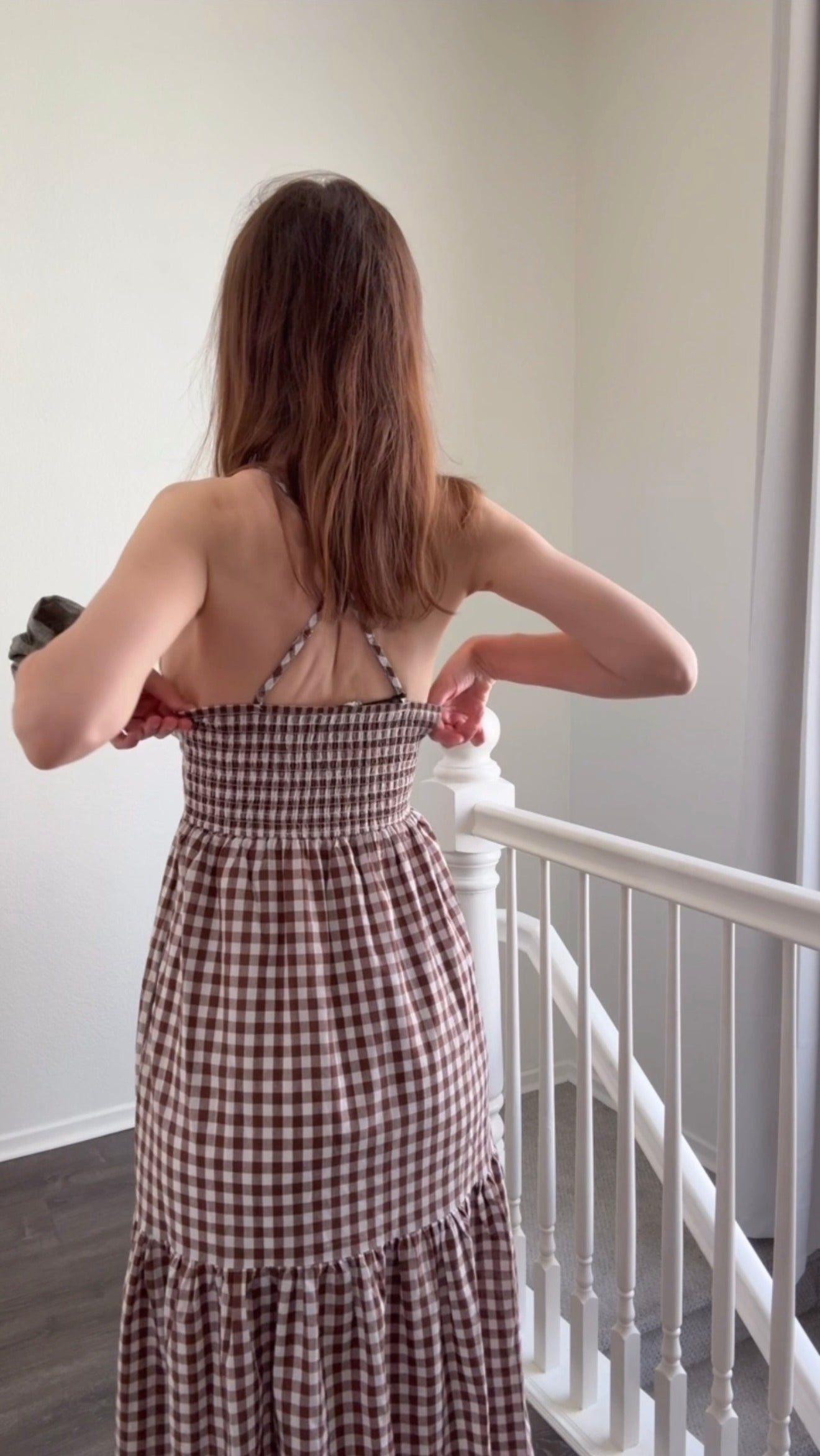Try-on video of Paloma brown gingham maxi dress showing fit, movement, and adjustable straps