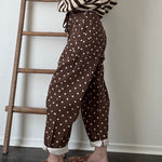 Model try-on video of Moxie Polka Dot Barrel Jeans in Brown showing the relaxed fit, curved leg, and cropped hem