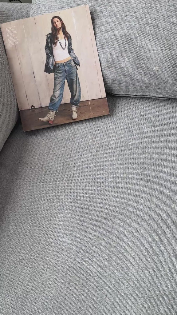 Close-up video showing knit texture and balloon sleeve detail of soft short sleeve sweater in dark mocha