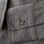 video Close-up of the semi-sheer pinstripe fabric and button