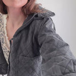 Try-on video of Chloe bow quilted denim jacket in black showing fit and movement