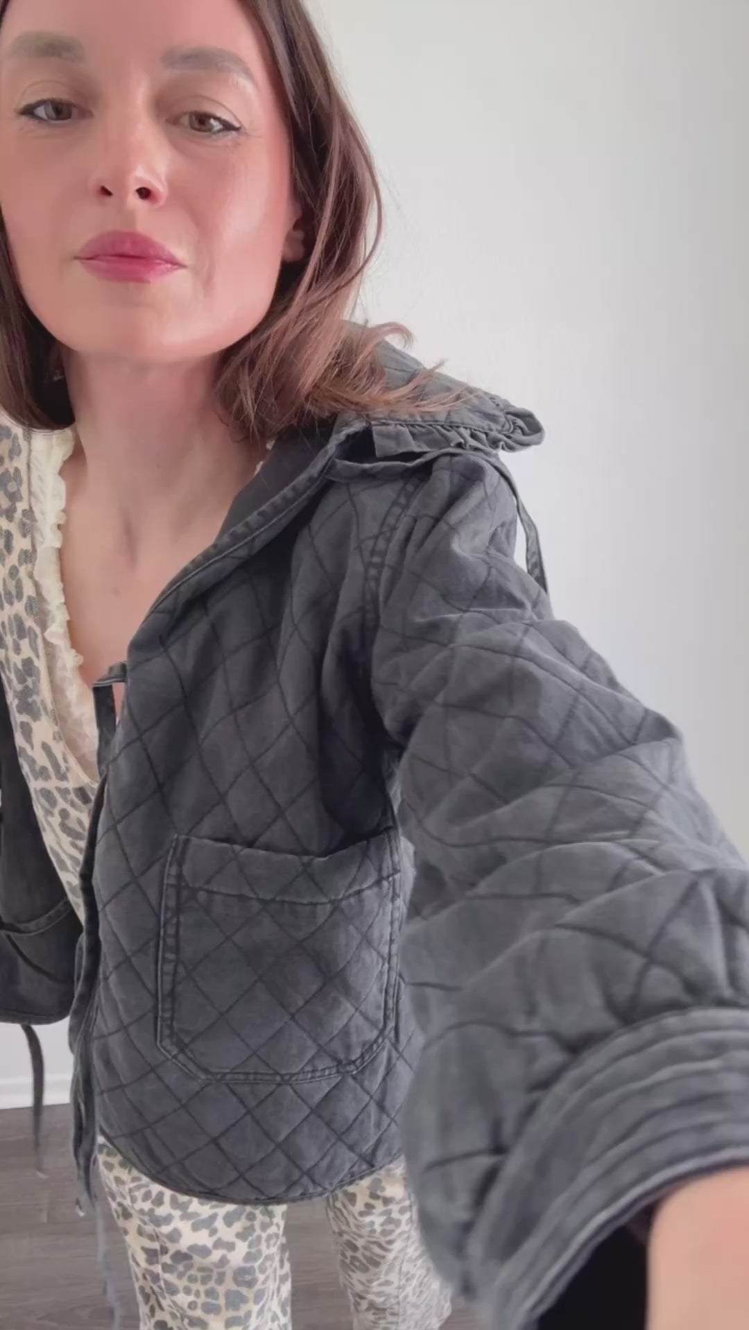 Try-on video of Chloe bow quilted denim jacket in black showing fit and movement