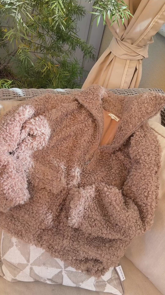 Woman wearing ultra soft half zip teddy jacket in taupe showing fit and oversized silhouette