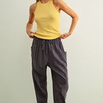 Woman wearing Quinn Loose Cotton Pinstripe Pants in blue and stone with relaxed fit and elastic waist - full casual outfit