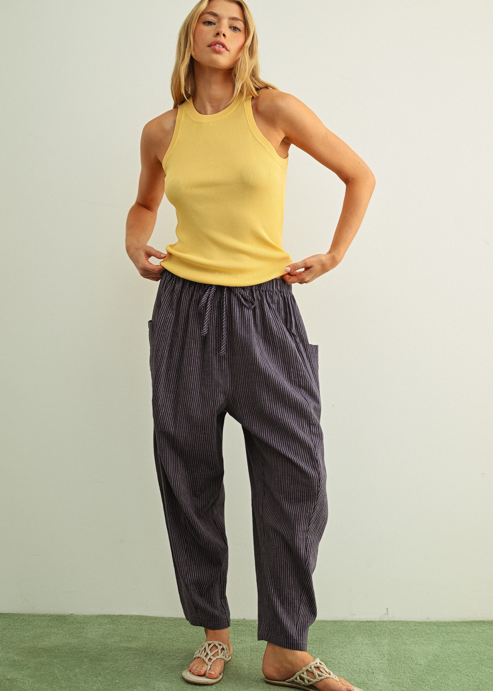 Woman wearing Quinn Loose Cotton Pinstripe Pants in blue and stone with relaxed fit and elastic waist - full casual outfit