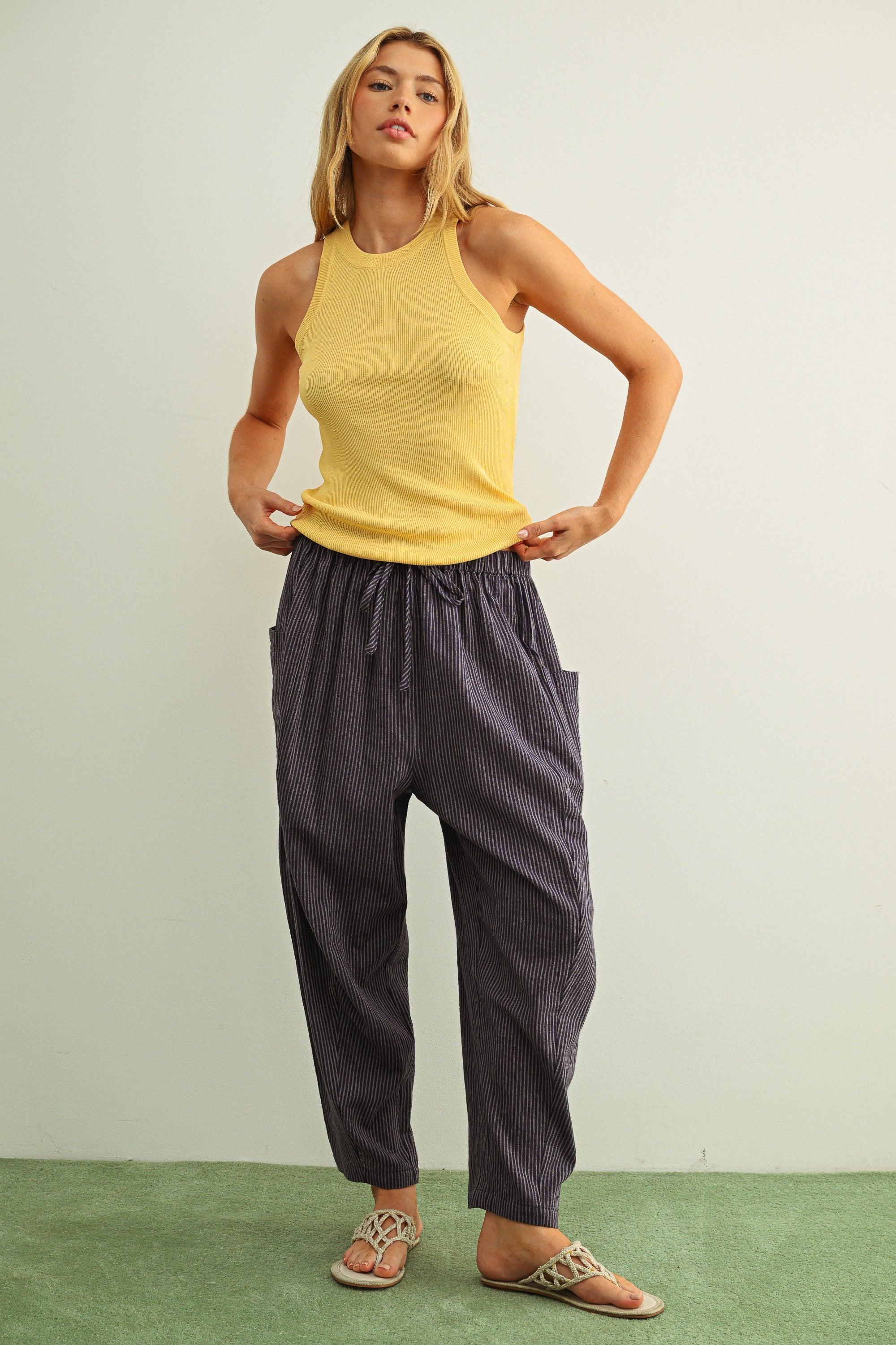 Woman wearing Quinn Loose Cotton Pinstripe Pants in blue and stone with relaxed fit and elastic waist - full casual outfit