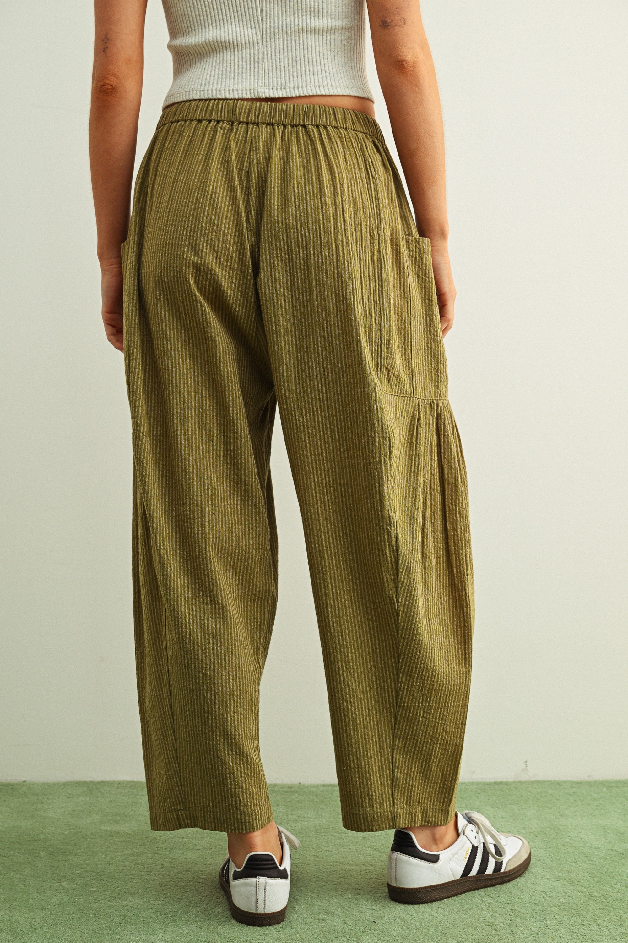 Back view of Quinn Loose Cotton Pinstripe Pants in green and stone