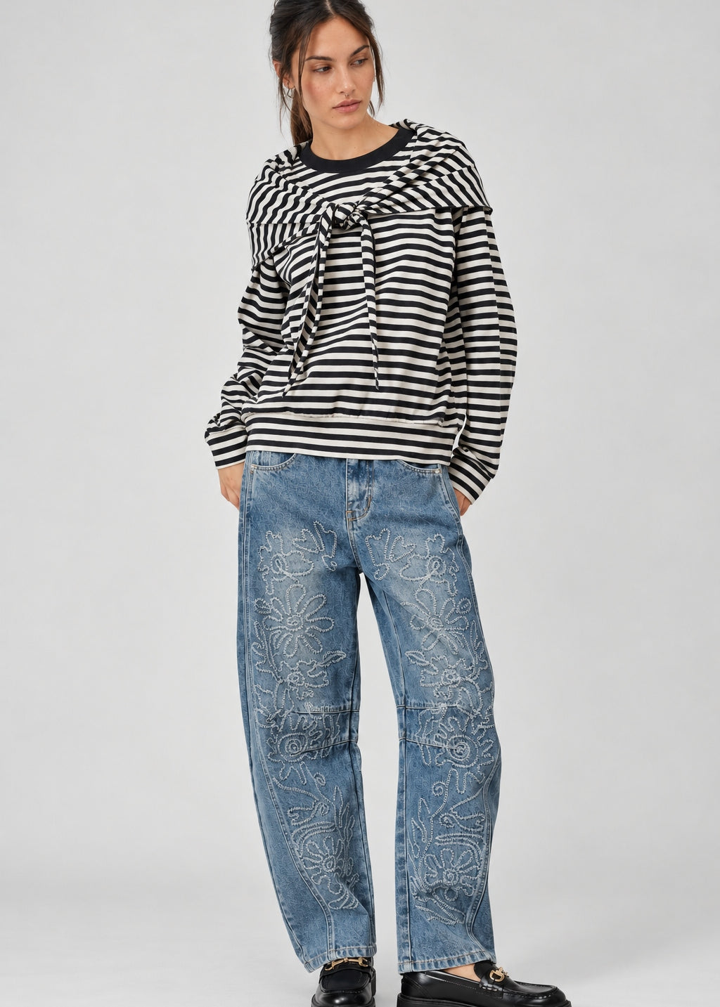 full outfit  of the Remi black and cream striped cotton sweatshirt with matching triangle scarf and jeans