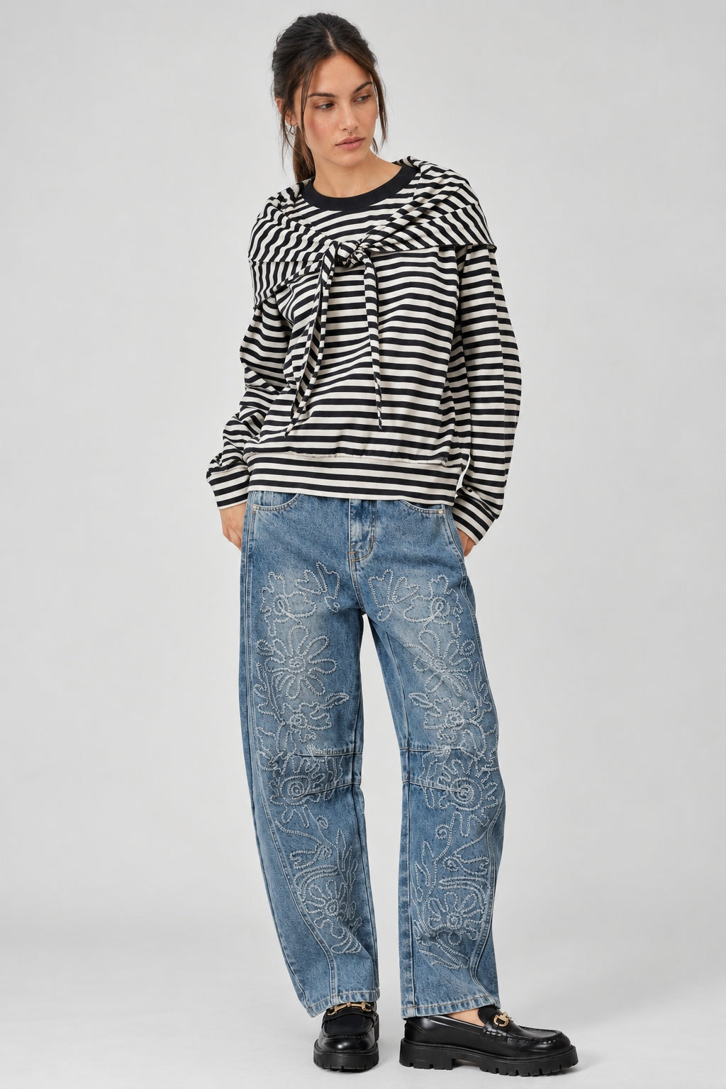 full outfit  of the Remi black and cream striped cotton sweatshirt with matching triangle scarf and jeans