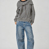 full outfit  of the Remi black and cream striped cotton sweatshirt with matching triangle scarf and jeans