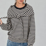Front studio view of the Remi black and cream striped cotton sweatshirt with matching triangle scarf tied around the hips